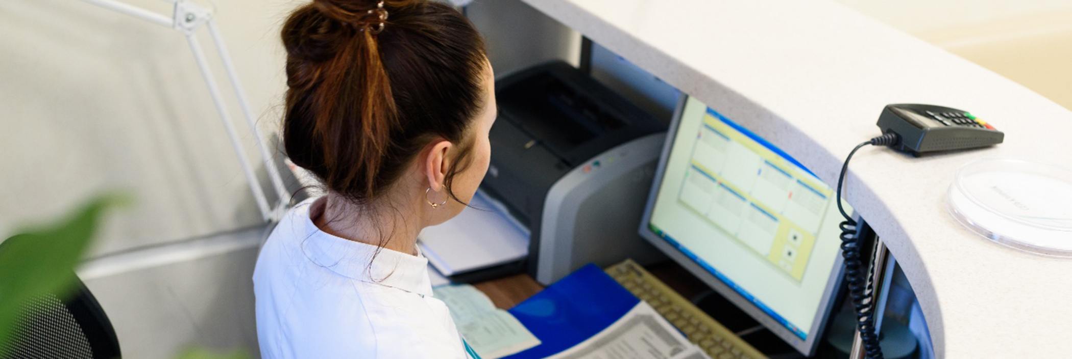 Receptionist at a desk